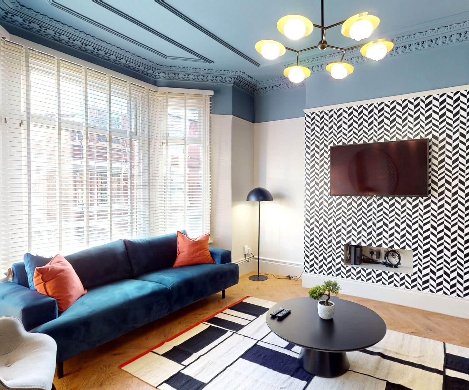 Comfy shared lounge with big cosy sofa, coffee table and large TV in professional house share in Aigburth