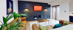 Modern living room in a shared house with comfortable seating and modern decor