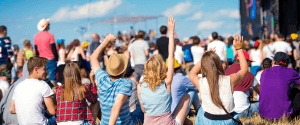 A group of young professionals enjoying an outdoor festival in Liverpool