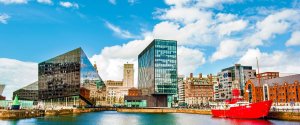 Modern office buildings in Liverpool's waterfront business district where young professionals work