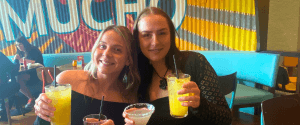 Two young professional friends enjoying bottomless brunch in Turtle Bay Liverpool