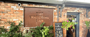 Sign outside The Watering Can, one of the best restaurants in Allerton, Liverpool