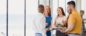 Young professionals enjoying food and conversation at casual networking event in Liverpool